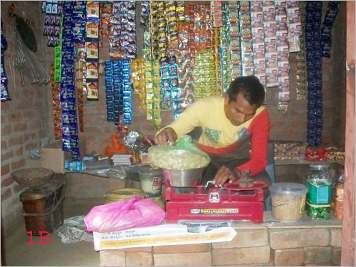 Graphic: Ganga Prasad measuring the product in his shop 